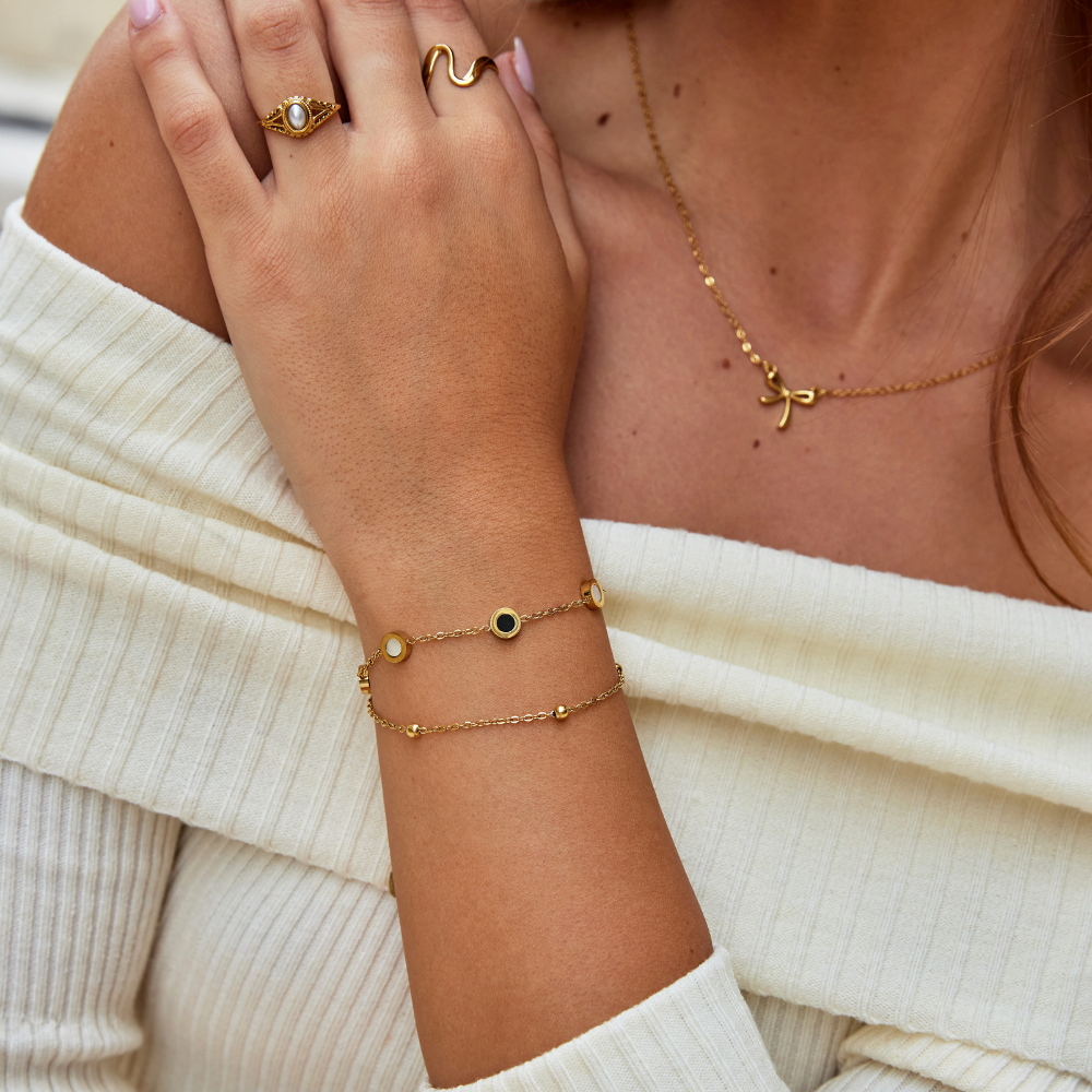 Bracelet en onyx et pierre blanche